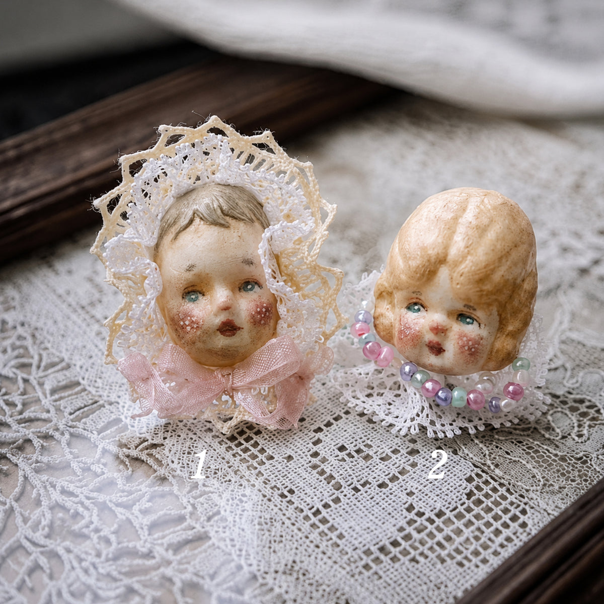 Numbered comparison of Lambwick Giant Baby and Pumpkin Head doll rings.