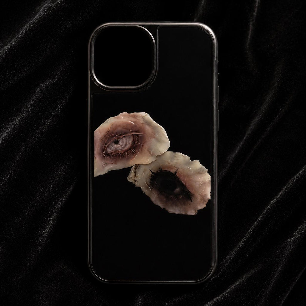 Black Surreal Eye phone case with two photographic shell-eye prints.