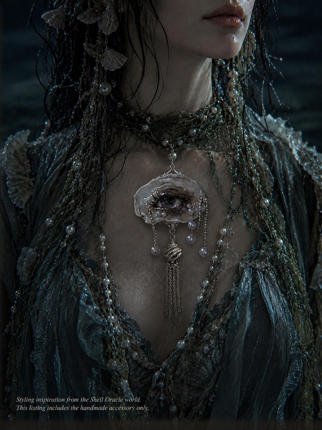 Editorial styling reference showing shell-eye jewelry against a dark green outfit; pictured piece may differ.